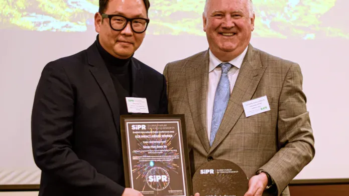 Sean Yu receiving his Impact Award