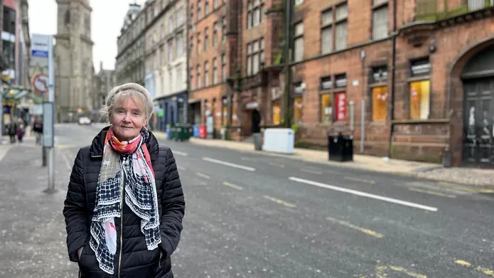 Professor Jill Belch standing on the pavement at Seagate, Dundee.