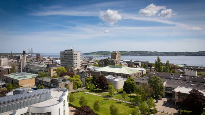 The campus green from the top of Belmont Tower. Looking over the city to the river Tay.