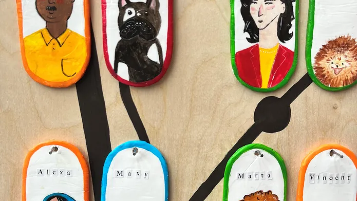 An artwork featuring images of dogs and dog owners on coloured dog tags