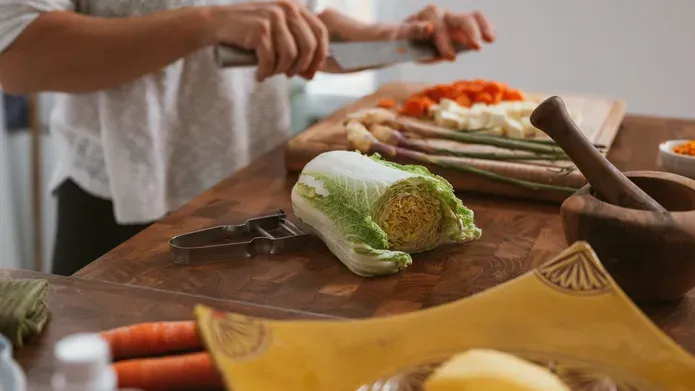 person chopping vegetables