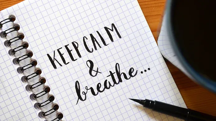 Notepad with the words 'Keep calm & breathe'