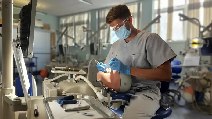 Student sitting in phantom head room at University of Dundee School of Dentistry