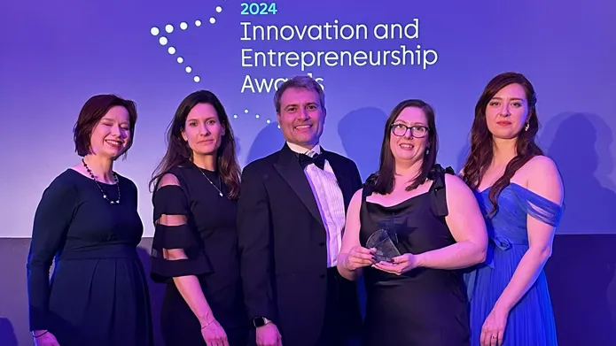 Members of the CeTPD team accept their award at the ceremony