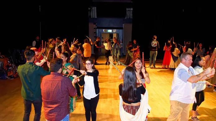 students in indian clothes celebrating a festival