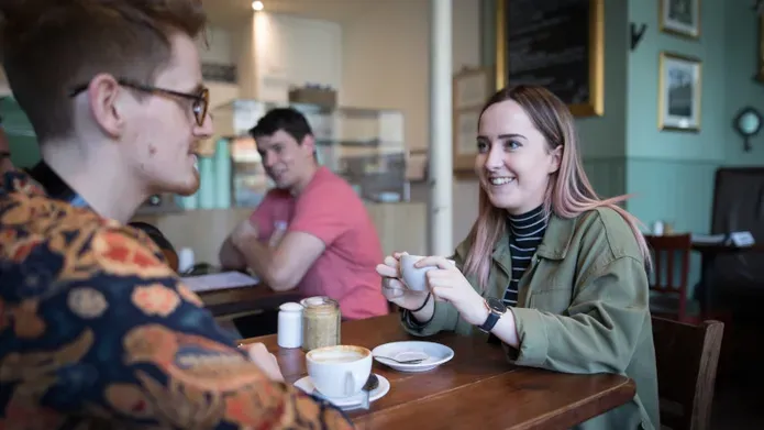 Students sitting in a cafe together
