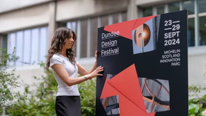 Graphic Design student Sophie O'Mullan poses with her winning work