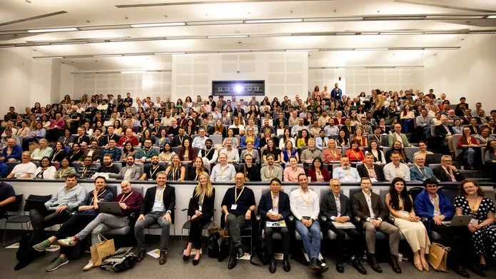 Delegates sitting in a lecture theare for the TPD in Focus symposium