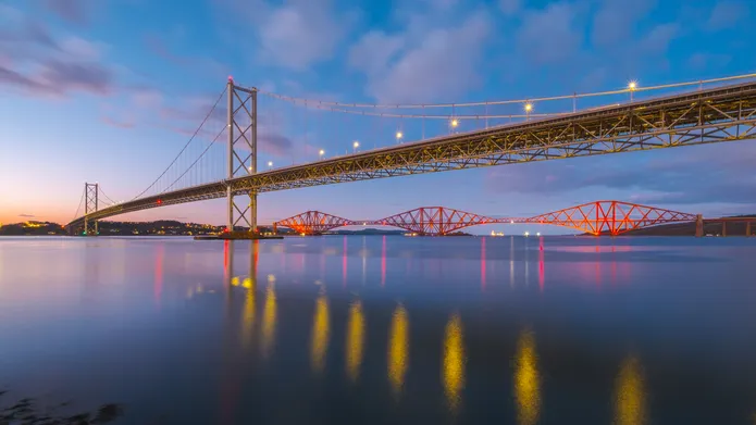 The Forth Road bridge and rail bridge at Edinburgh during sunset
