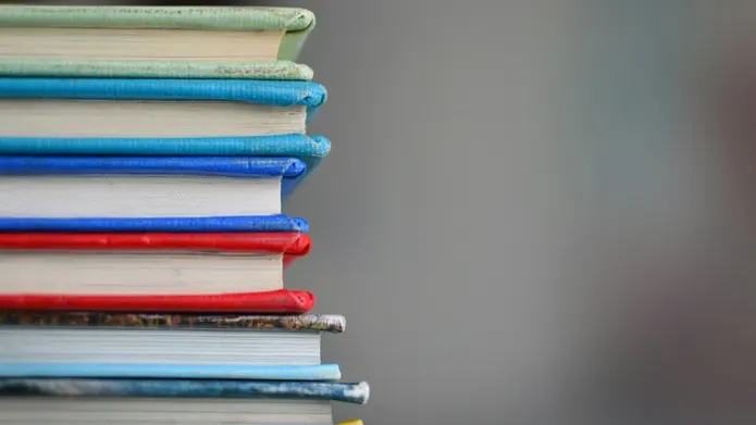 A stack of books in various colours