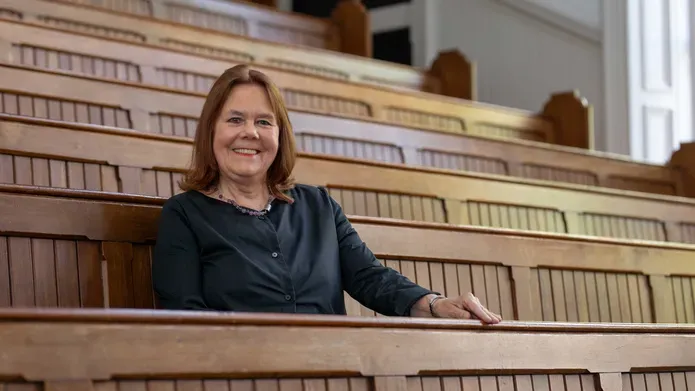Lady Clark sitting in a Law lecture theatre
