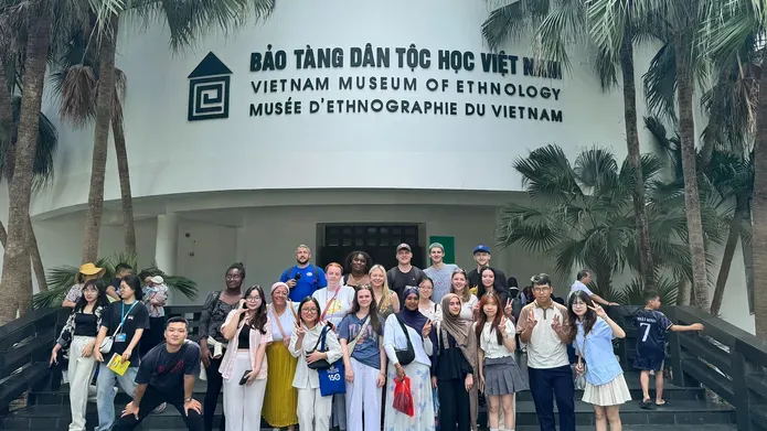 A group of students outside the Vietnam museum of ethnology