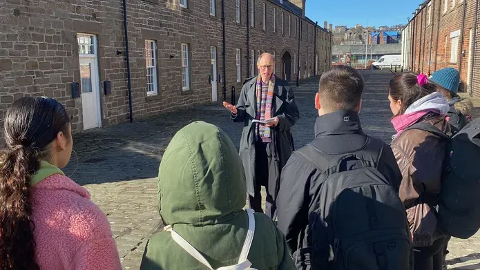 Tour guide and particpants on a walking tour
