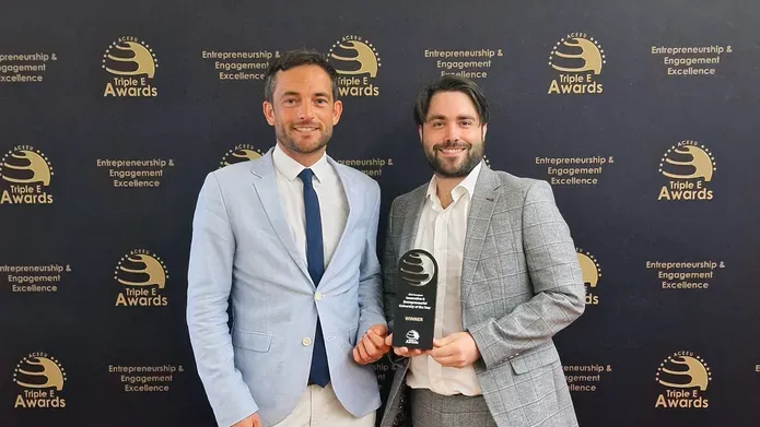 University of Dundee staff members at the triple E awards holding the Entrepreneurial university of the year trophy