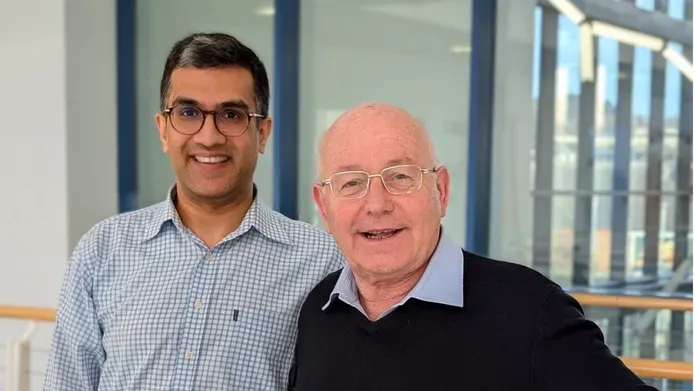 Arpan Mehta and Philip Cohen stood next to each other smiling