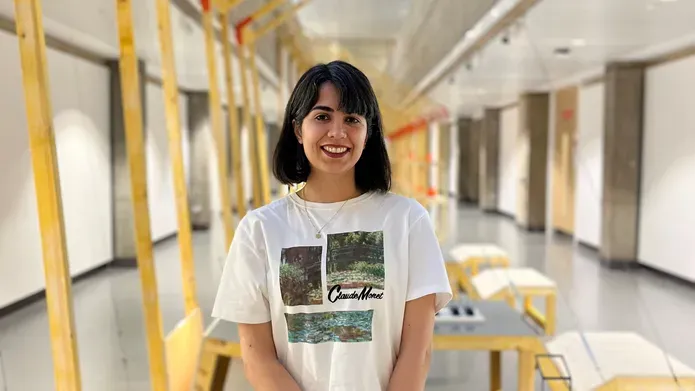 Mahtab Karami standing in a corridor at Duncan of Jordanstone.