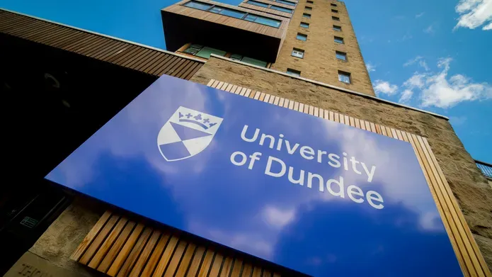 image of University of Dundee sign on the dies of a building