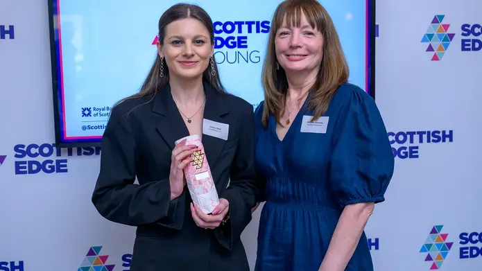 Justyna Skop stands alongside Marjory Sweeney of Scottish Enterprise with her award.jpg