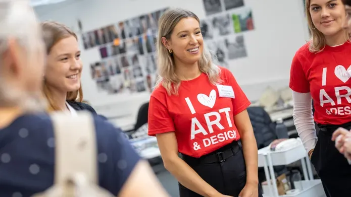 Student Ambassadors with I heart Art & Design t-shirts standing in studio in DJCAD
