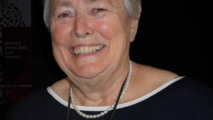 Dr Sheila Willis, former Director General of Forensic Science Ireland, smiling in front of a black background