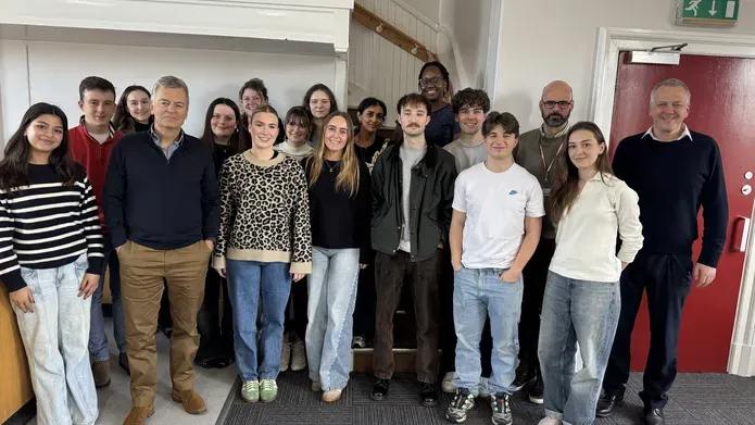 A group of people pose for the camera