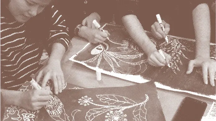 workshop participants designing on a table