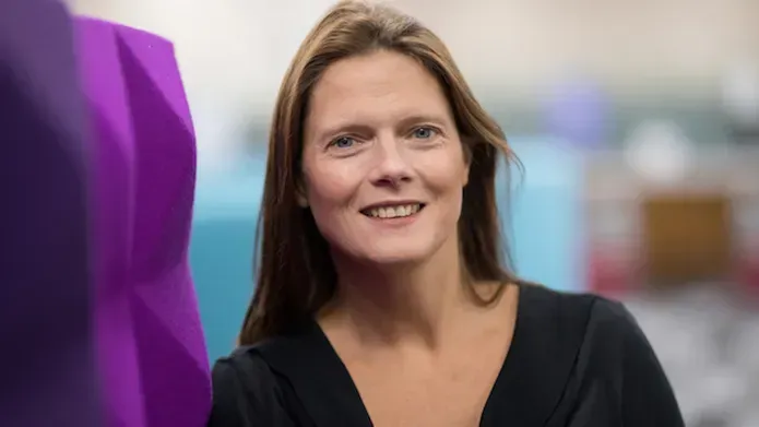 Dr Sarah Martins da Silva looking at camera in headshot pose