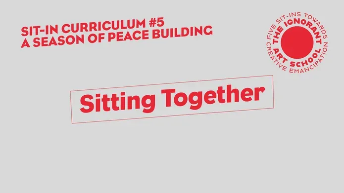 Title slide in red and grey reads Sitting Together - stretched diagonally across the screen in an irregular box