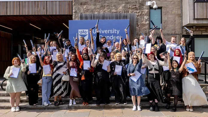 Access Summer School students standing at the steps of the Tower Building with their certificates
