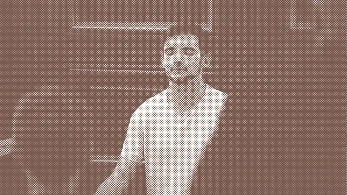 Man sitting eyes closed meditating