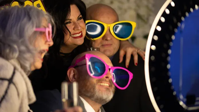 people with fun sunglasses on at party