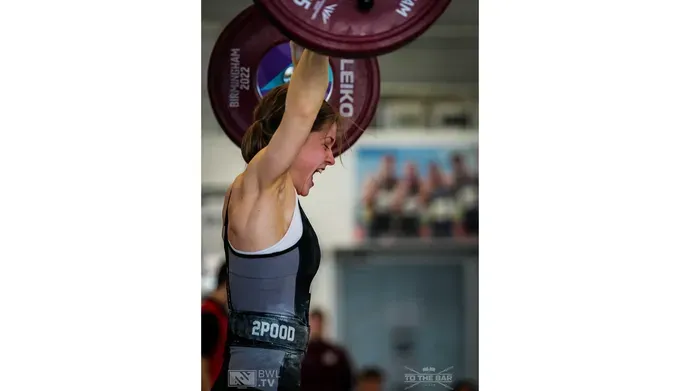 Alex Mackay lifting weights