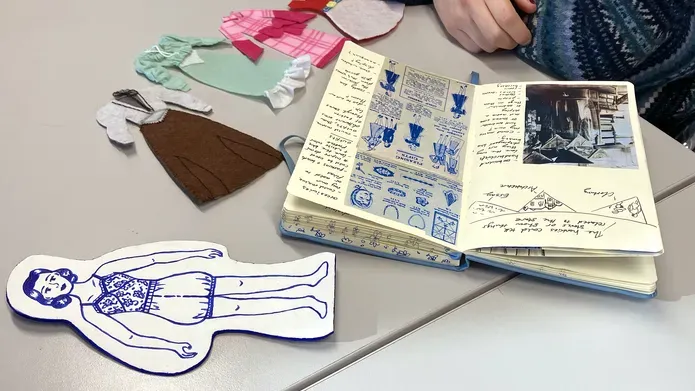 A selection of brochures, catalogues alongside some of the newly-created artwork from the exhibition