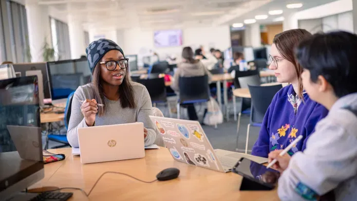 students working together in the library