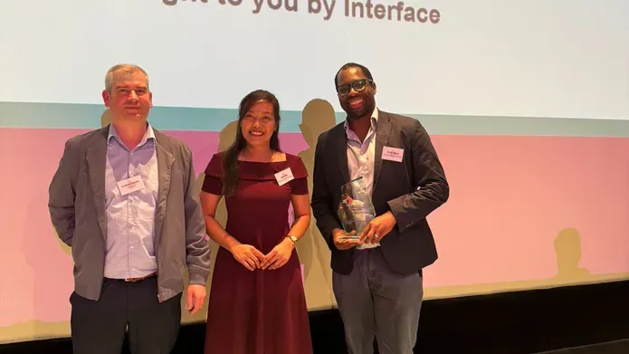 Dr Ify Mordi and colleagues with their award on stage