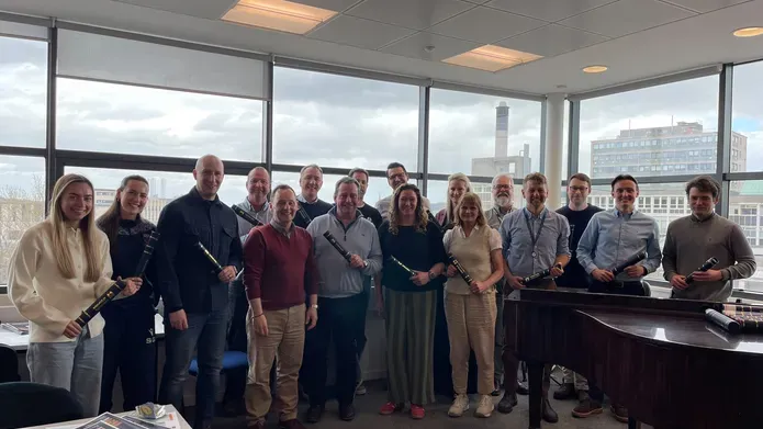 A group of business leaders posing for the camera after receiving their course certificates