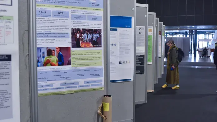 A series of conference poster boards angled away from the camera