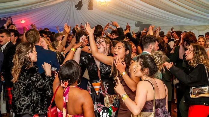 Students celebrating graduation dancing at the Grad Ball at DUSA