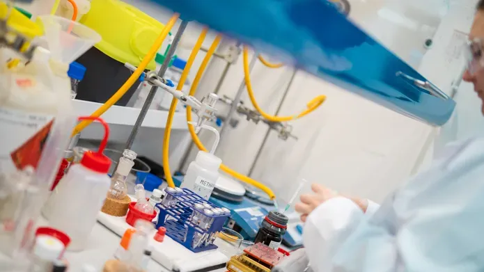 A female scientist in lab coat working in a laboratory
