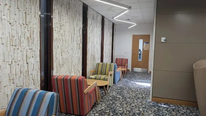 A row of occassional chairs set up in a corridor