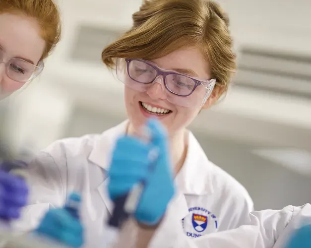 Two students working in a lab