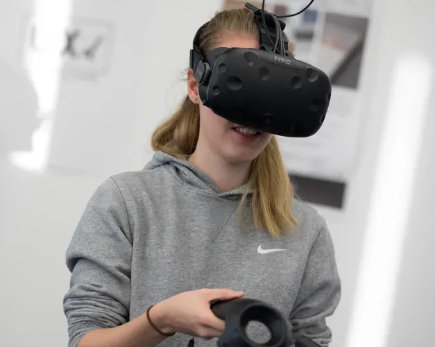 A student with a virtual reality headset on