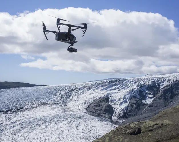 Photograph of a drone in flight above Skálafellsjökull glacier