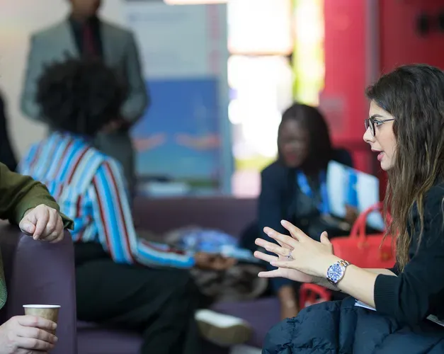 two people sitting and talking