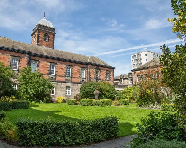 Red brick building with a little clock tower