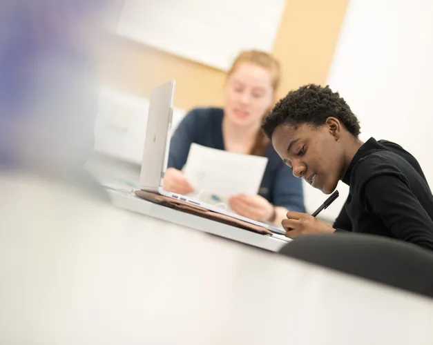 Students working at a desk.