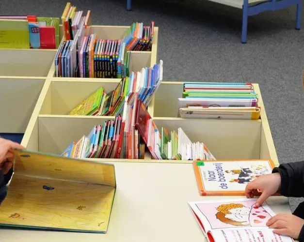 Boy and girl reading books