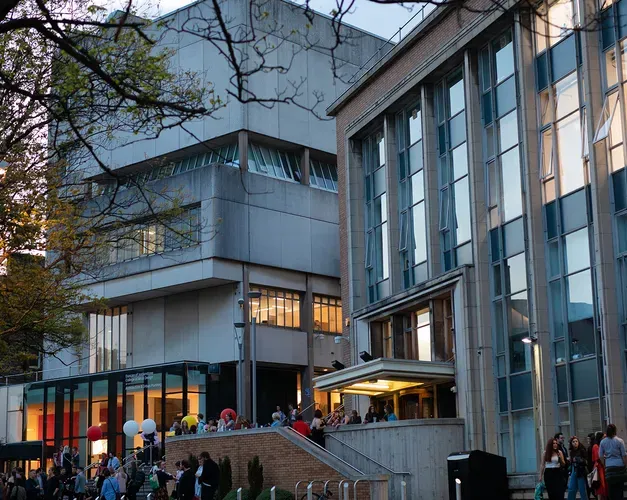 people standing outside the art school