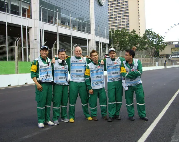 a group of people in green and white clothes