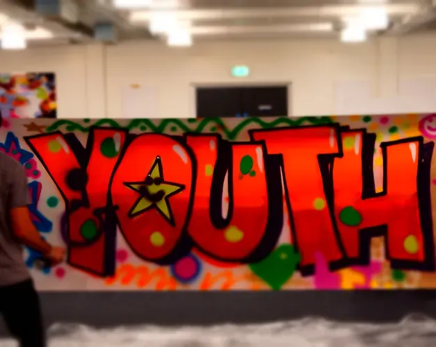 Graffiti on a wall spelling "youth"